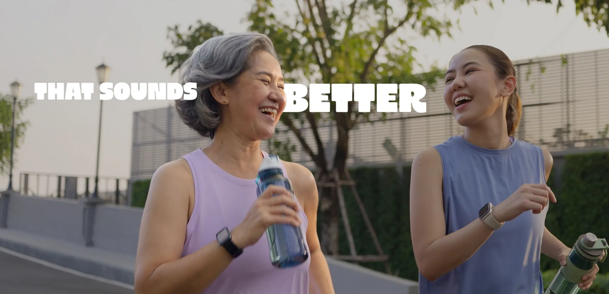 Two women laughing together on an evening walk, under the words That Sounds Better